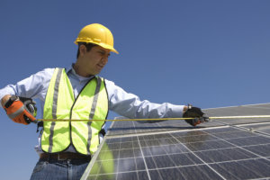 man installing solar panel