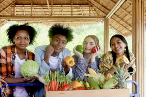 Group of happy Multiethnic teenager friend holding organic food products