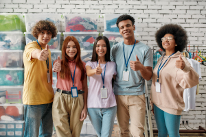 Young and diverse volunteer group smiling at camera