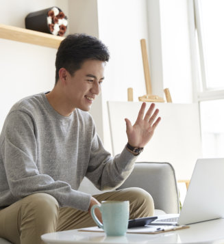 Male working at home meeting online.