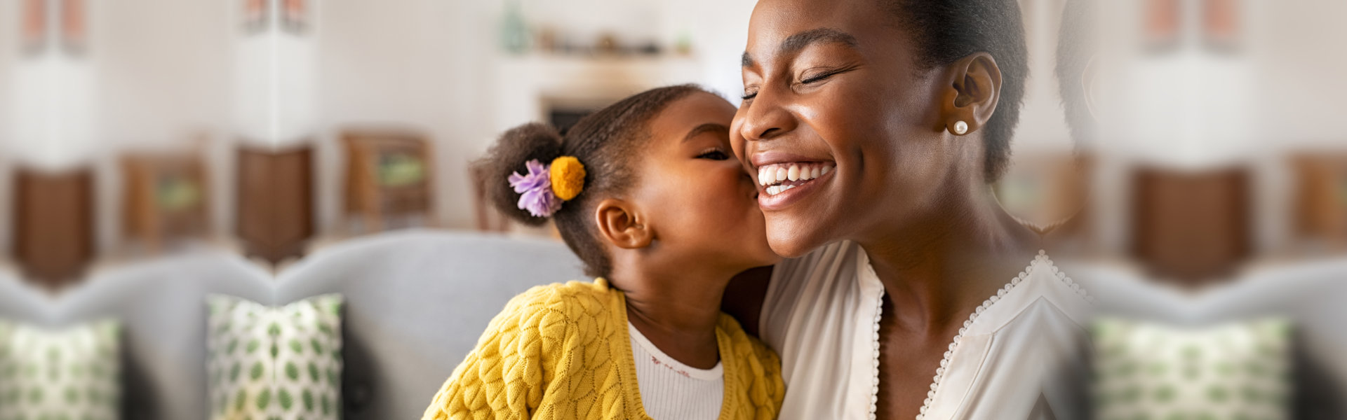 child kissing a women